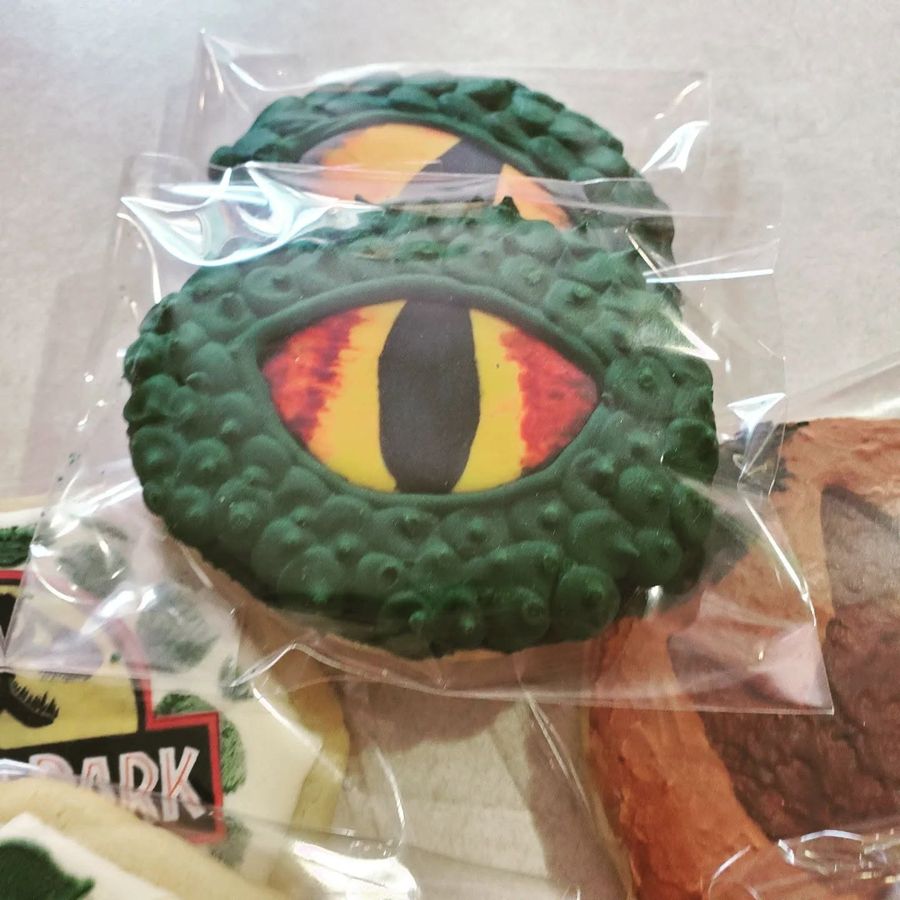 Green dinosaur eye sugar cookies from a Jurassic Park cookie set