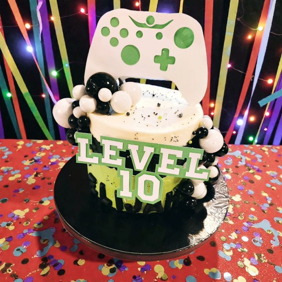 Level 10 video game birthday cake with a controller topper